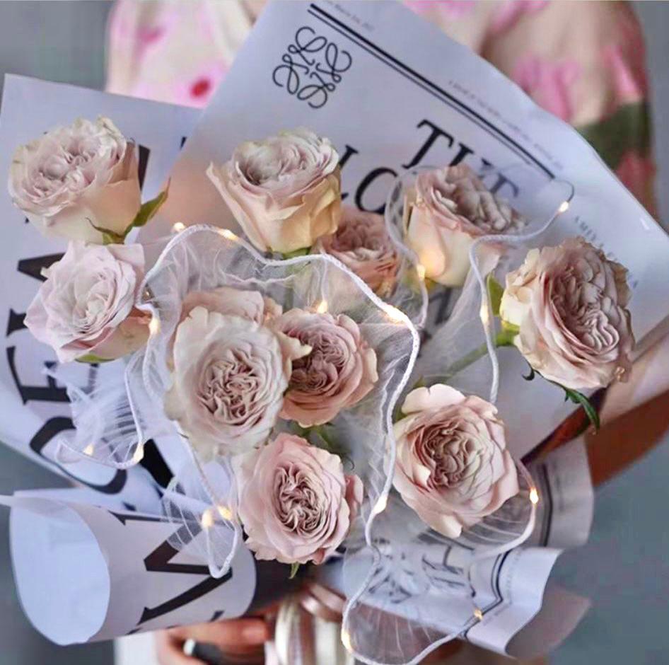 1 dozen roses with LED Lights and newspaper style wrapping