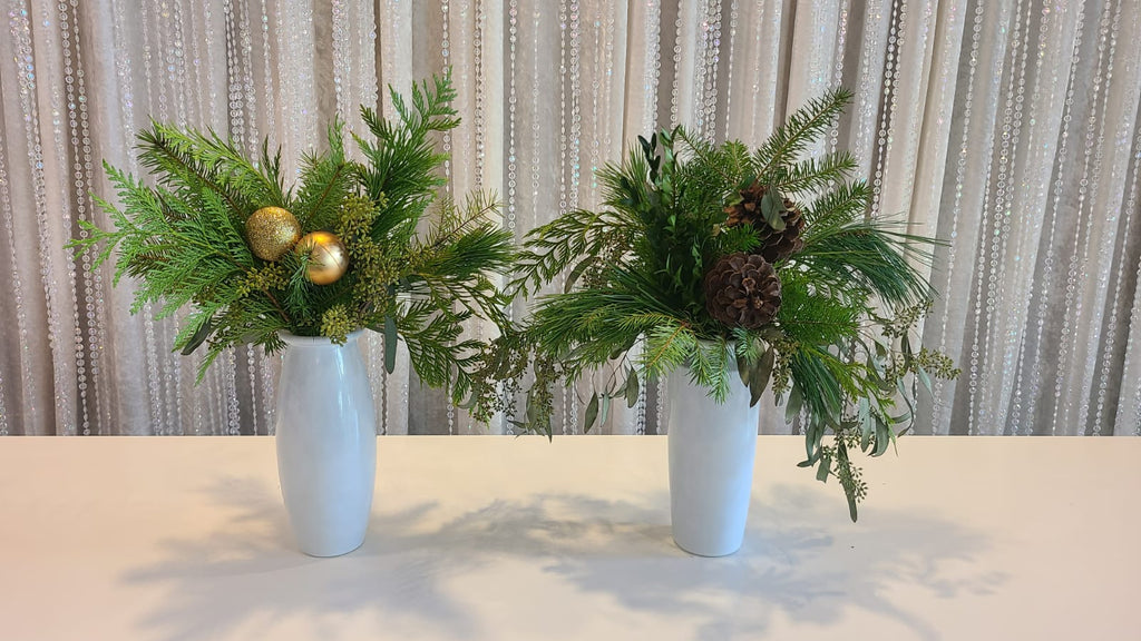 Holiday Grandeur - Red Rose, Ranunculus, Norfolk Pine & Laurel Draping  Christmas Floral Arrangement in Tall Glass Vase